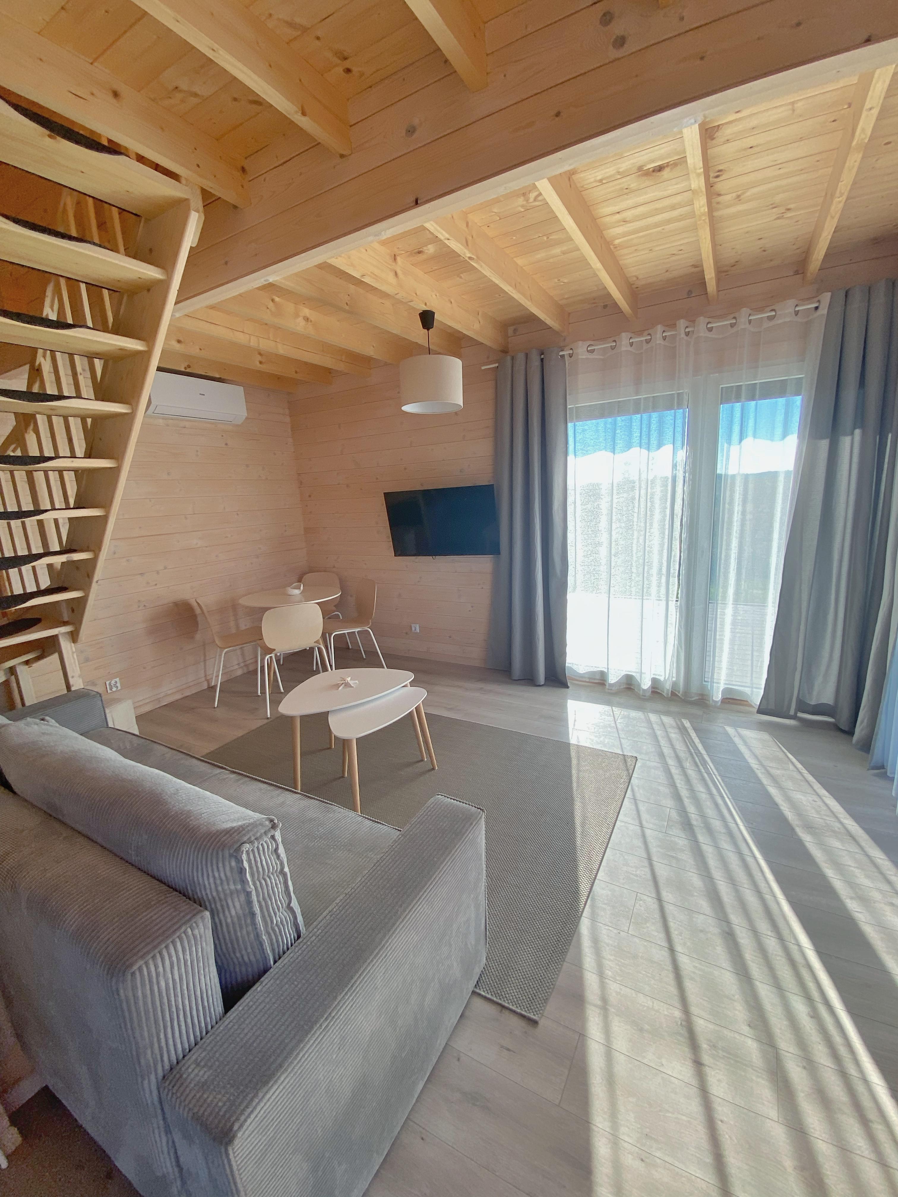 Ferienhaus Rewal Relax gemütliches Wohnzimmer mit Kamin